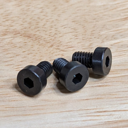 Close-up view of three Haas 06-0329 replacement bolts