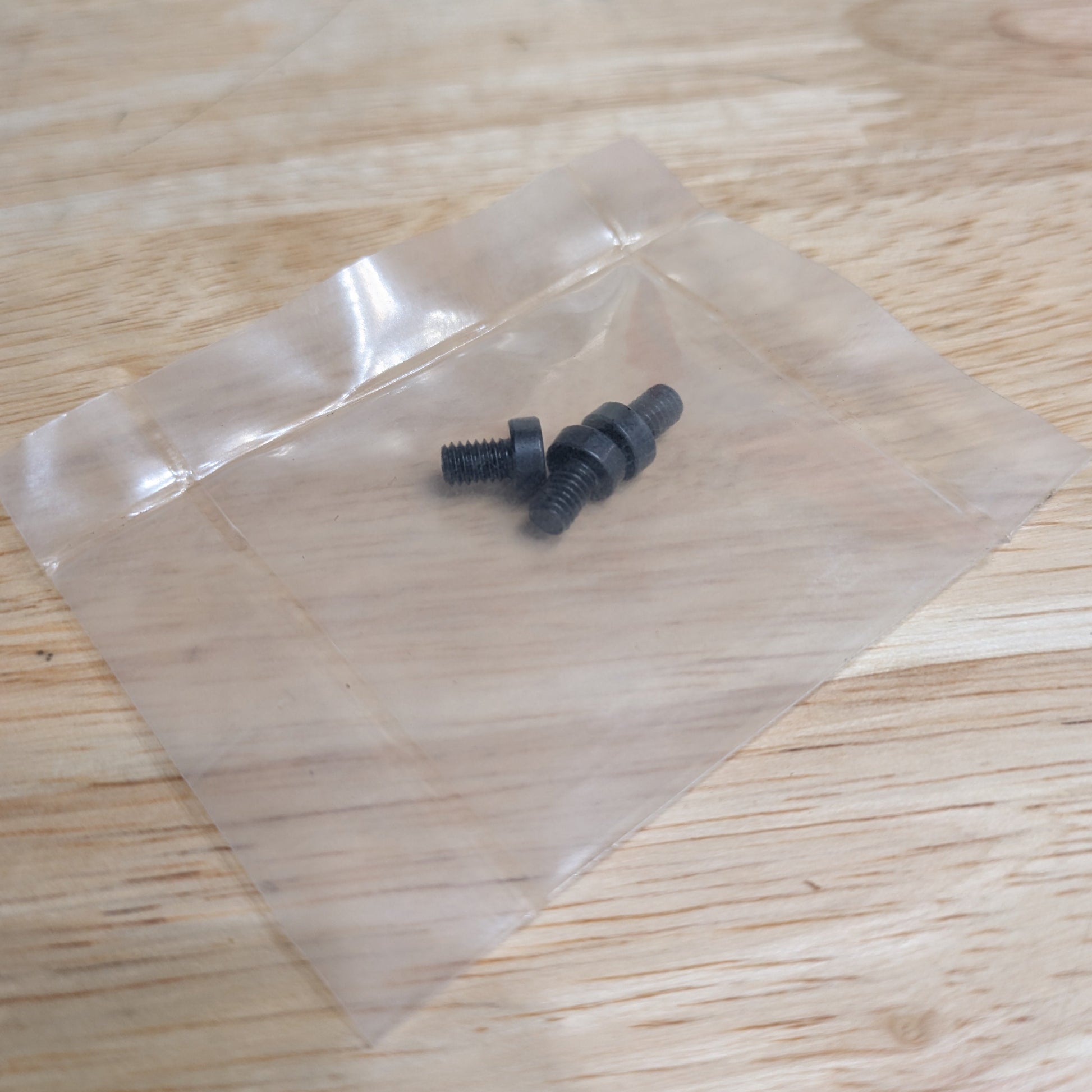 Three Haas 06-0329 replacement bolts packaged together