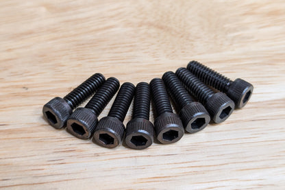 Close-up image of all eight Mitee-Bite 60500 replacement bolts