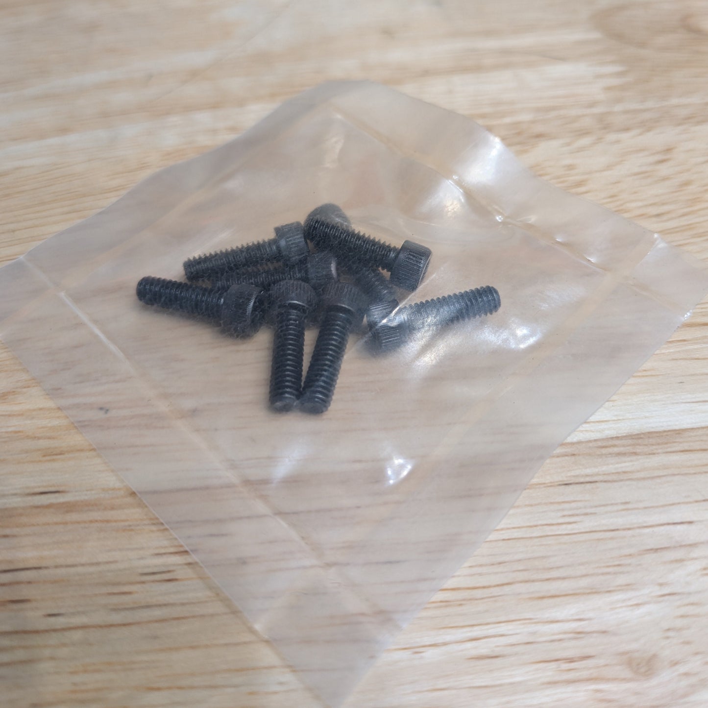 Packaged set of eight Mitee-Bite 60500 replacement bolts